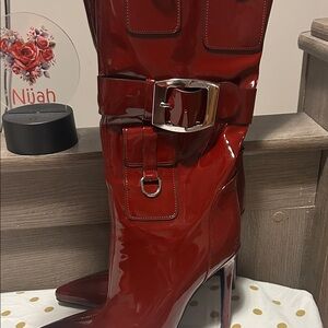 Women's Patent Burgundy Stiletto Knee Boots with Buckle Accent. Worn once size 9